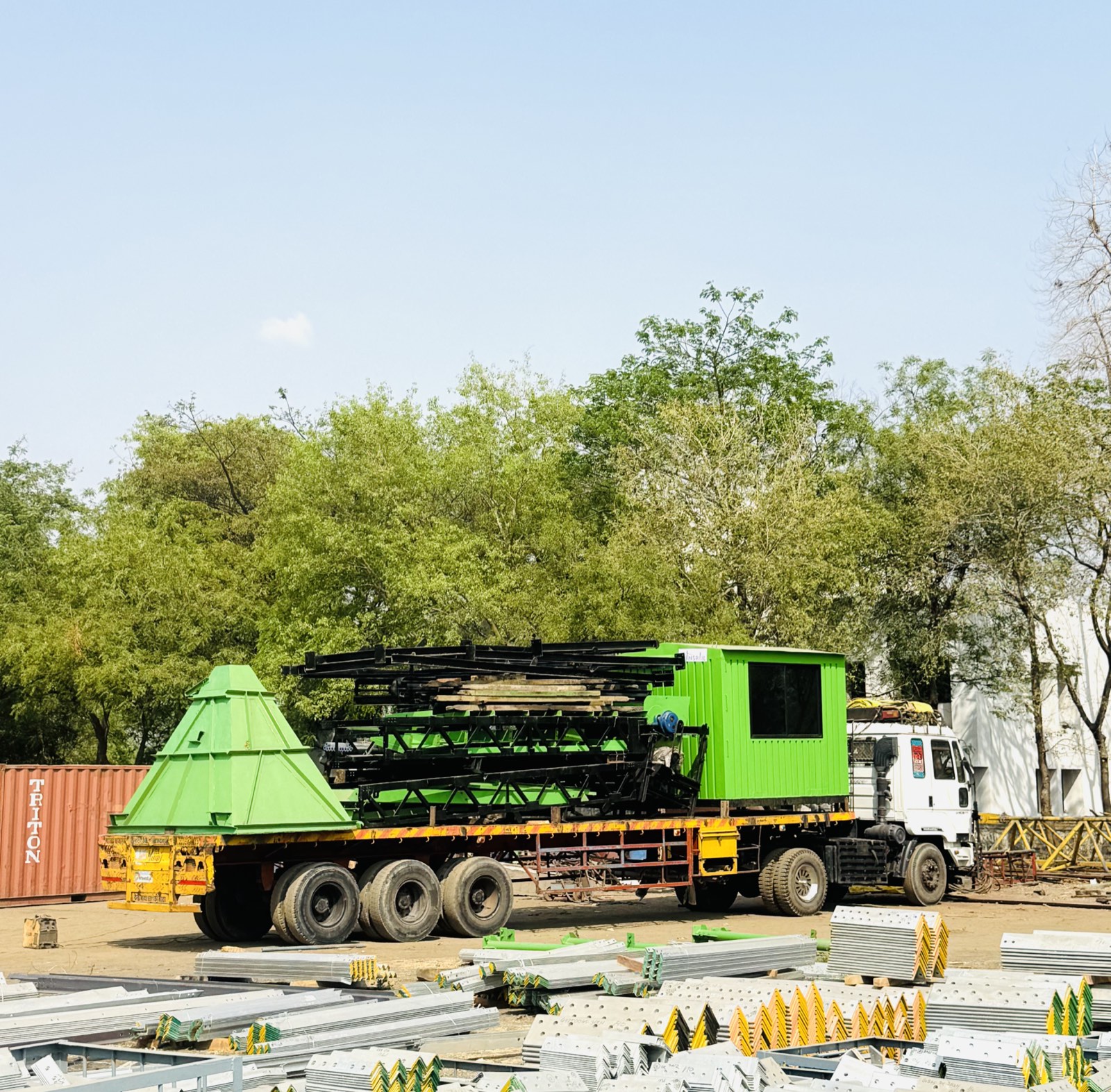 Batching plant components staged in the yard before dispatch
